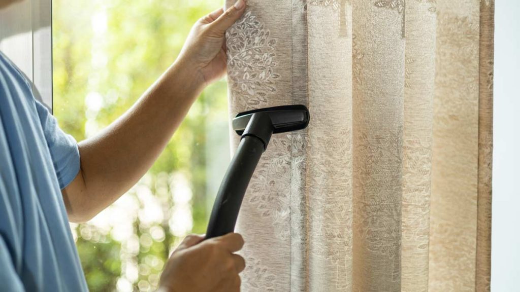 A professional curtain cleaning service in Nassau County, showcasing clean drapes enhancing indoor air quality and aesthetics.