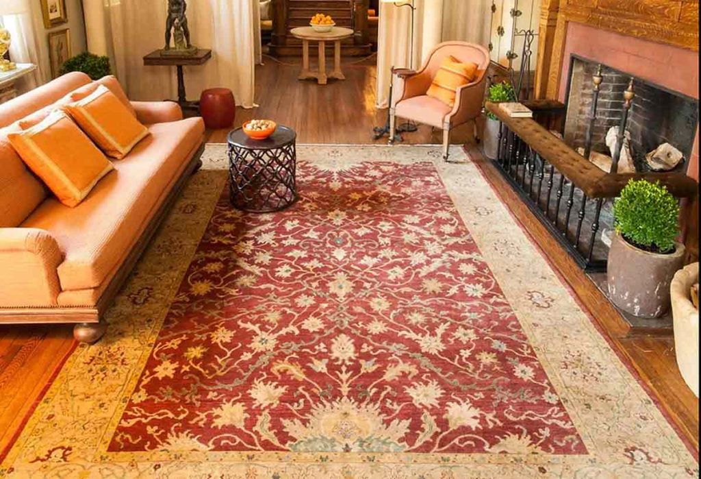A beautifully patterned area rug with intricate designs in warm colors - rug appraisal
